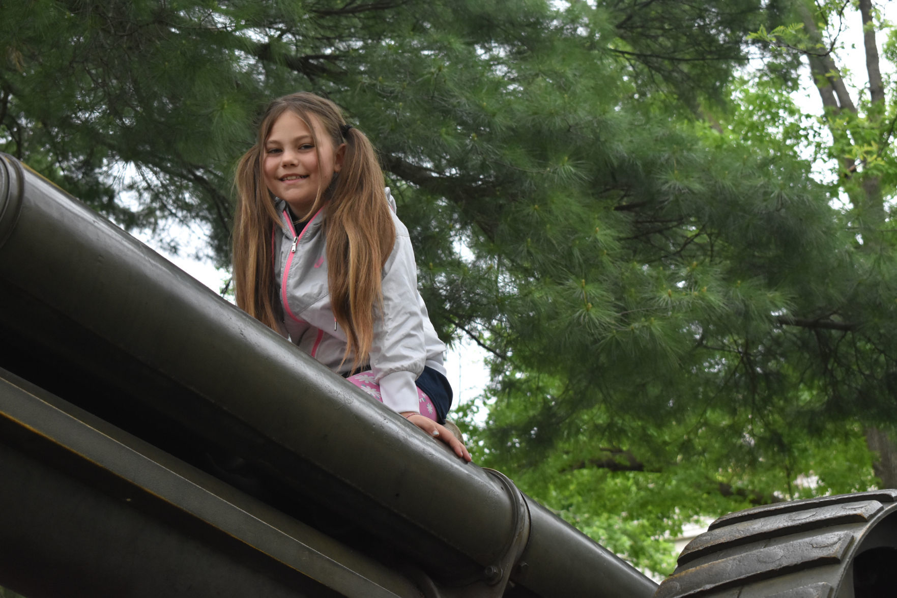 Maggie Parchem climbs on the cannon